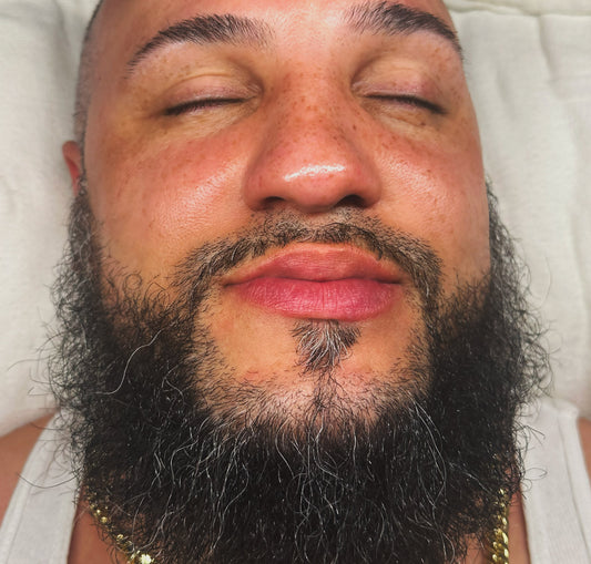 Close-up of a latino man's face after getting a skin and beard facial