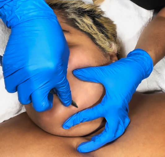 Close-up of a latina woman's face while receiving a dermaplaning